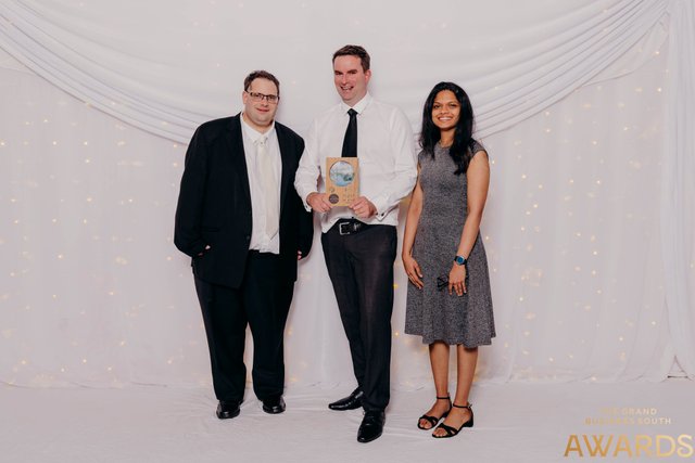 GetHomeSafe team posing with the Innovation Award trophy at the gala dinner