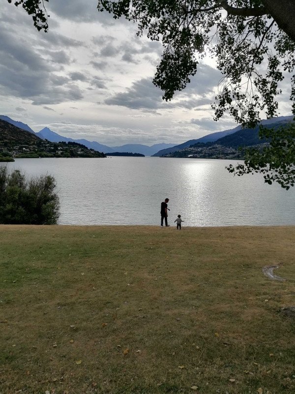 Leandro and his son Daniel walking towards a lake in Queenstown