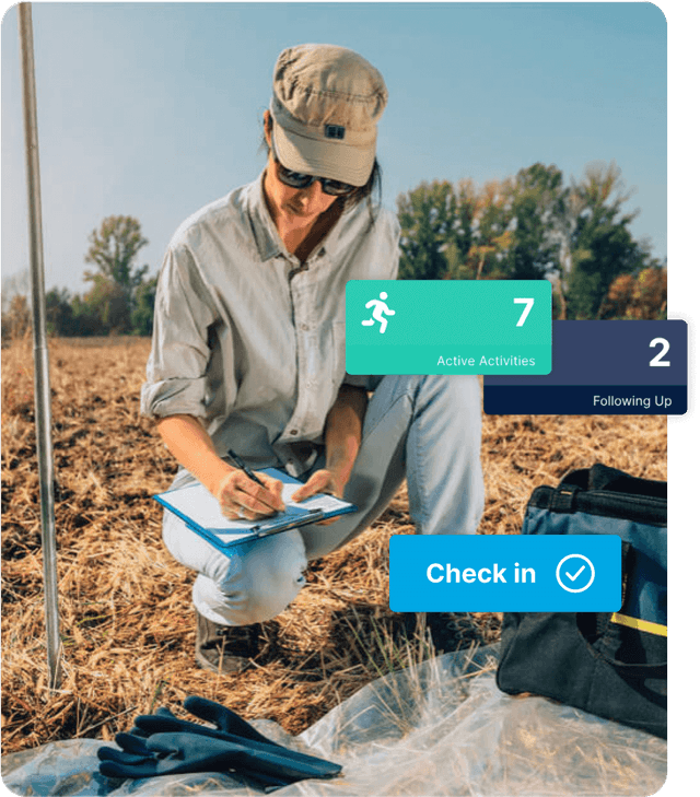 A field worker kneeling in a paddock filling in a clipboard, overlaid with GetHomeSafe dashboard tiles for active activities and a Check in button