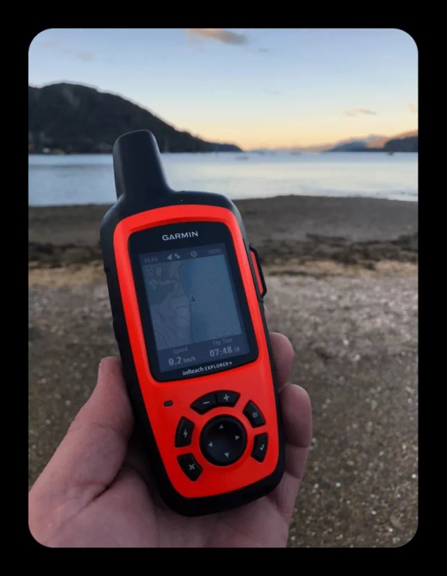 Garmin inReach Explorer+ satellite device displayed alongside a paired smartphone