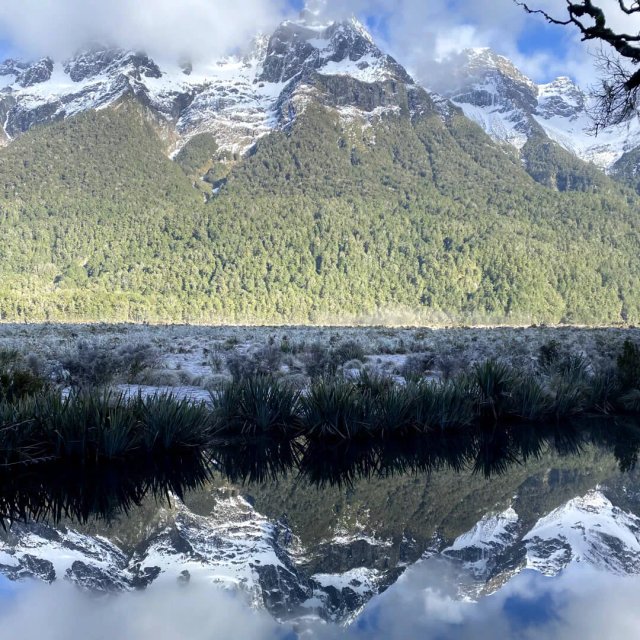 Lakefront walk at Te Anau with snow-capped mountains in the distance